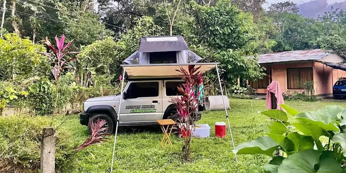 camping car vehicle parked in a backyard