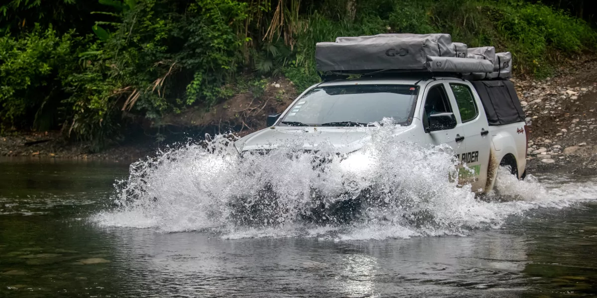 4x4 vehicle cross a river in costa rica