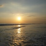 Hitting the sunset while waters remain calm at Santa Teresa. Santa Teresa beach near to sunset
